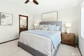 Primary with walk-in closet and en-suite bath with double vanity.