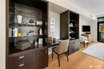 Beautiful built-in offers additional storage, display shelves and comfortable discreet desk.