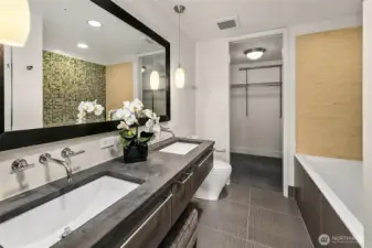 Ensuite 5-piece primary bath has a deep soaking tub, separate shower, dual sink vanity and walk-in closet.
