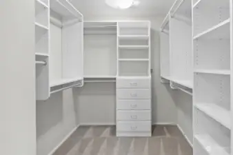 A spacious and generously sized walk-in closet, providing ample room for organized storage and easy access to your wardrobe.