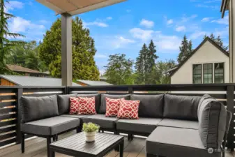 Step outside, rain or shine and cozy up with friends on your covered upper terrace deck, just off the kitchen & dining room.