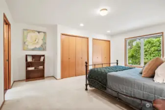 Large primary bedroom with two large closets and tons of natural light.