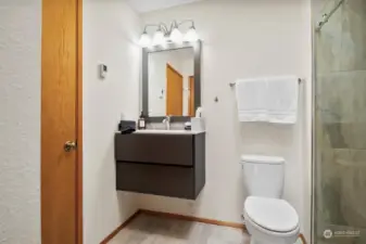 Secondary bathroom has entrance from second bedroom and hallway.