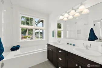 Primary Bath With Deep Tub, Dual Sinks and Separate Shower.