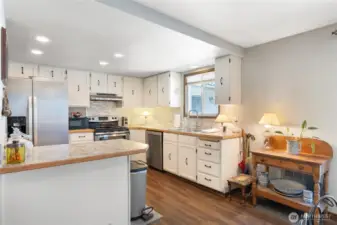 Stainless Steel appliances and light colors were a great refresh for this home!