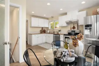 Just off the living room is this large kitchen with tiled floors and gracious dining area.