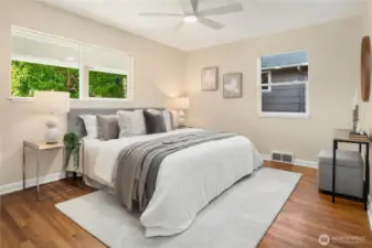 The bedrooms are all very large and can each easily handle king sized beds. This is the first of the two main floor bedrooms off the west side of the house.