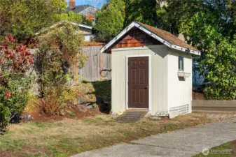 A garden shed sits off the back corner of the lot.