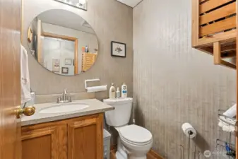 Downstairs powder room located in the central hallway.