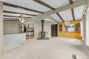 Another angle of large living/dining great room area with vaulted ceilings and open floorplan.