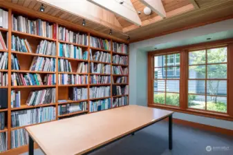 Big skylights make this south end of the studio/office bright and light with built-in bookcases.