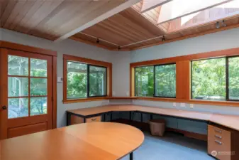 The north side of the studio/office.  These desks are removable. To the east or behind this room is another room for storage with a sink.