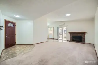 Open plan living space with newer gas firplace