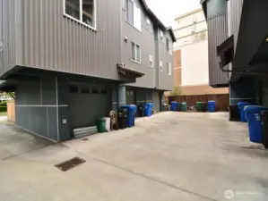 Rear part of the unit with private driveway to access garage.