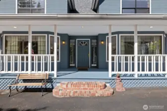 Charming entry with stained glass sidelight windows.