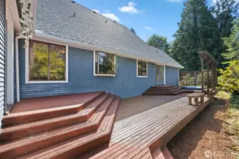 Back deck off of Kitchen and Primary Suite.