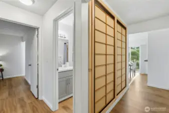 The entry has a custom Shoji door display, luxury vinyl plank flooring throughout.
