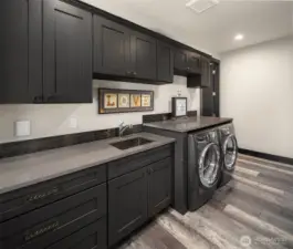 Expansive laundry room with plenty of storage