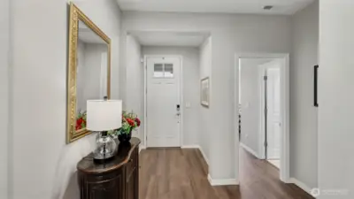 Inviting entryway with luxury vinyl plank flooring flows throughout the main living areas and bedrooms, creating both durability and style