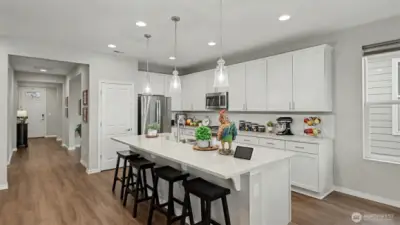 Check out the large island, gas cooktop, and high-end appliances—perfect for hosting gatherings or enjoying a quiet evening at home