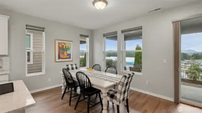 Dining area adjacent from the kitchen with mountain views and access to the covered outdoor patio