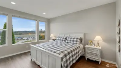 Primary bedroom with mountain views and custom blackout shades