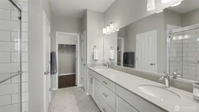 Spa like primary bathroom with a massive walk-in closet
