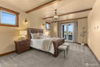 Primary Suite with sliding door to covered deck and hot tub.