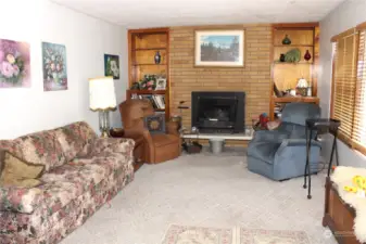Living Room with Wood Fireplace Insert.