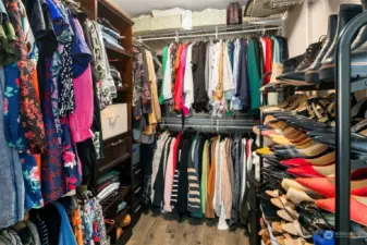 Huge walk in closet with custom organization
