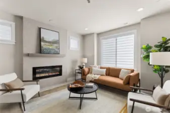 The family room has a large window and plenty of room to relax and unwind with a wall mounted TV location surround sound in the ceiling and an electric fireplace for your enjoyment.  Blinds and AC also included!