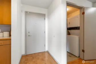 Entrance to the unit and laundry room on the right