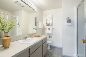 En suite primary bath with walk - in shower