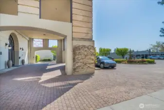 Elegant Courtyard Entrance Featuring a Fountain and Convenient Exterior Parking