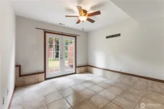 4th bedroom downstairs with ceiling fan has french doors that lead out to the backyard
