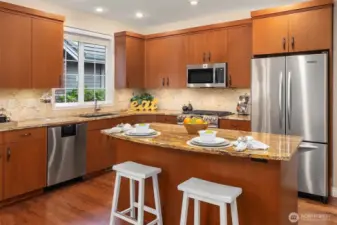 A full-height backsplash complements this kitchen.