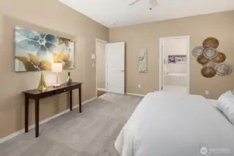 The primary bedroom boasts a private bath and a walk-in closet.