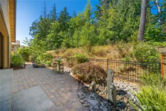 The peaceful backyard is thoughtfully landscaped, fully irrigated, low maintenance, landscape lighting and the lovely water feature!