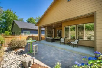Two covered patios and extensive hardscape greatly expands your outdoor living space.