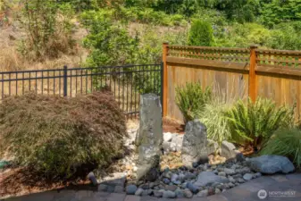 Relax on your back patio listening to the tranquil water feature.