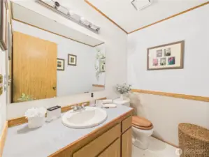 The main floor half bath is located conveniently centrally for you and your guests.