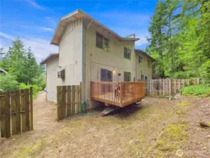 The back yard is partially fenced off butt could easily be fully fenced to help keep your furry friends safe.