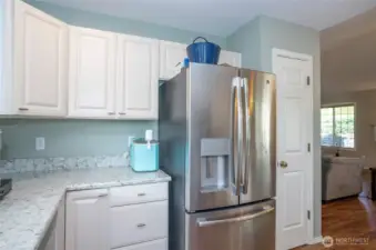 Abundant counter space complements the kitchen’s functional layout.