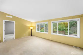 Living room room leads into the primary bedroom