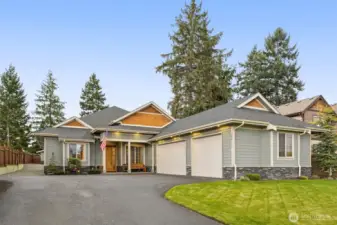 Beautiful single-story home featuring five total garage bays