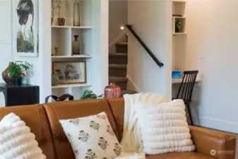 The Smart Home Center to the right of the stairway features built-in shelves & a data port. The Smart Home tablet serves as the home base for the Home Automation Suite. (video doorbells, lighting, thermostats, door locks & voice control functionality).