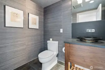 First step on the right, the powder room.