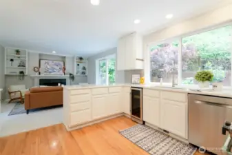 Just off the kitchen, the family room offers a comfortable, relaxed space perfect for everyday living. A cozy gas fireplace anchors the room, creating a warm and welcoming ambiance year-round.