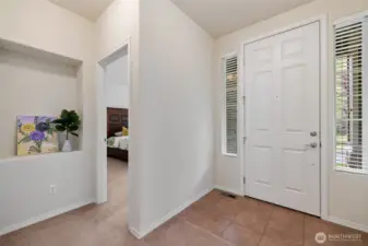 A tile entryway into a bright space welcomes you.