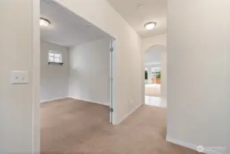 The room with the french doors doubles as an office/den space.